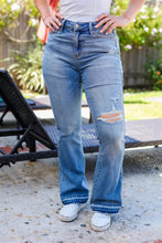 Load image into Gallery viewer, Judy Blue Medium Wash Mid Rise Release Hem Distressed Bootcut Jeans
